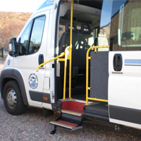 View of side access with lowered handrail and step.